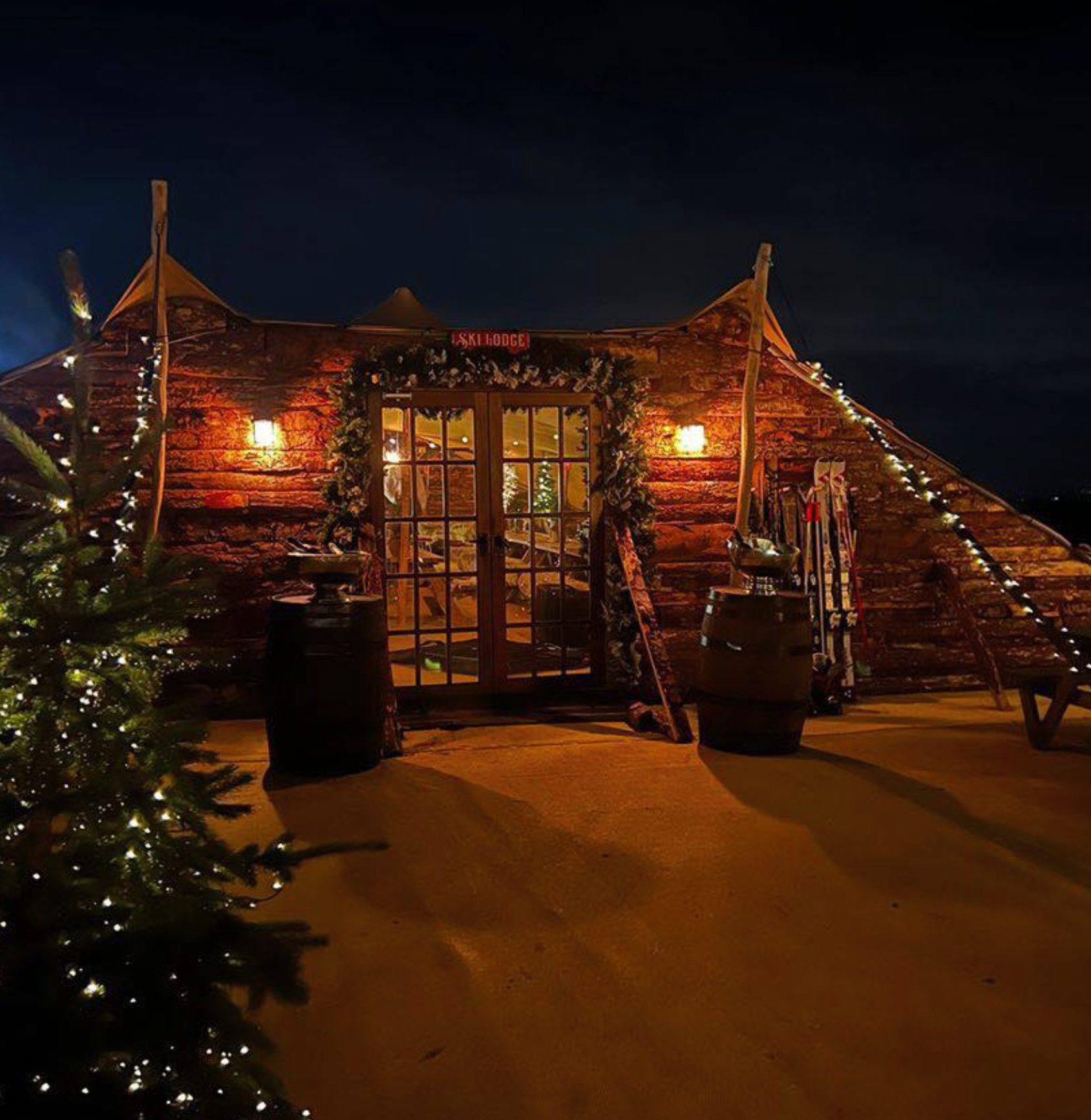 a stretch tent with rustic cladding to create a ski lodge style space