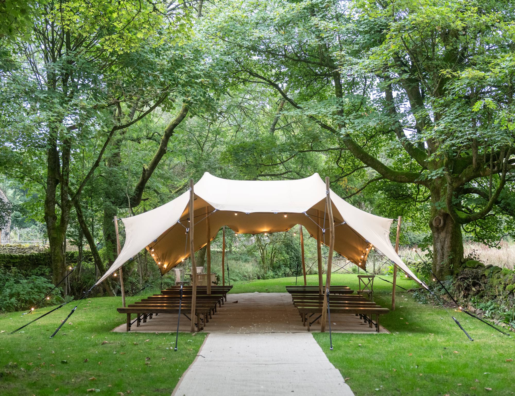 stretch tent set up for outdoor ceremony