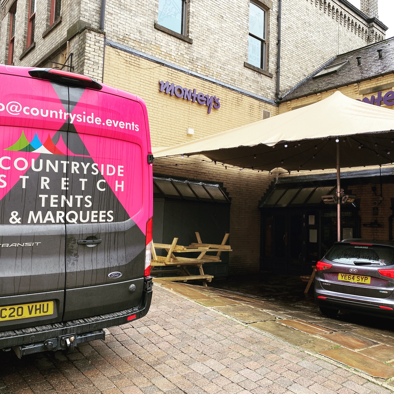 countryside events van next to a stretch tent