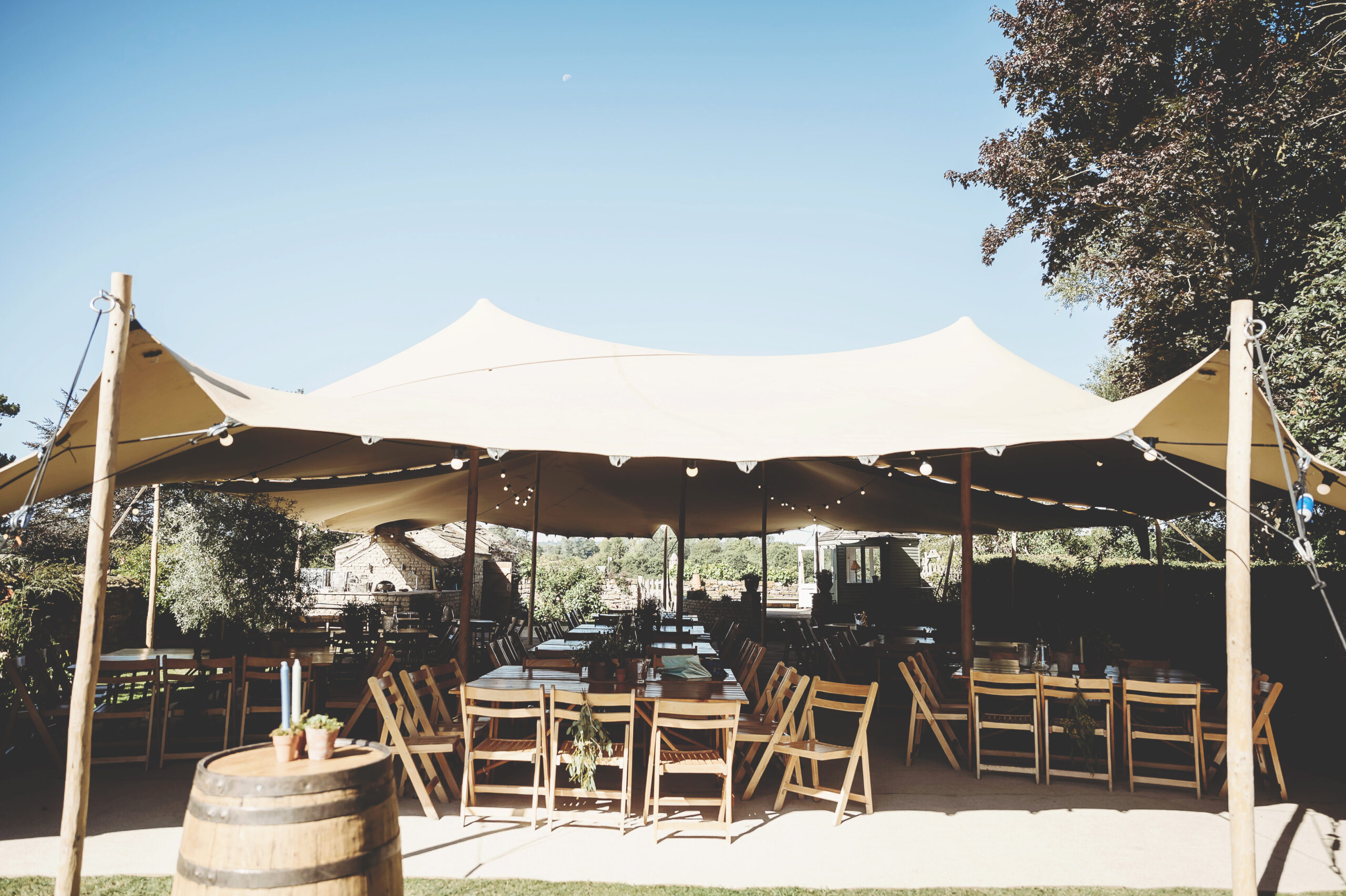 A chino colour stretch tent in a garden wedding setting, tent by Countryside Events, photo by Wooden Hill Images