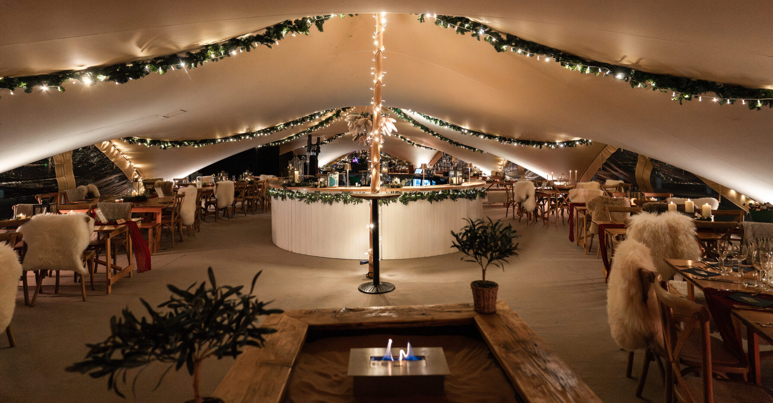 stretch tent at night, decorated for a Nordic themed Christmas event