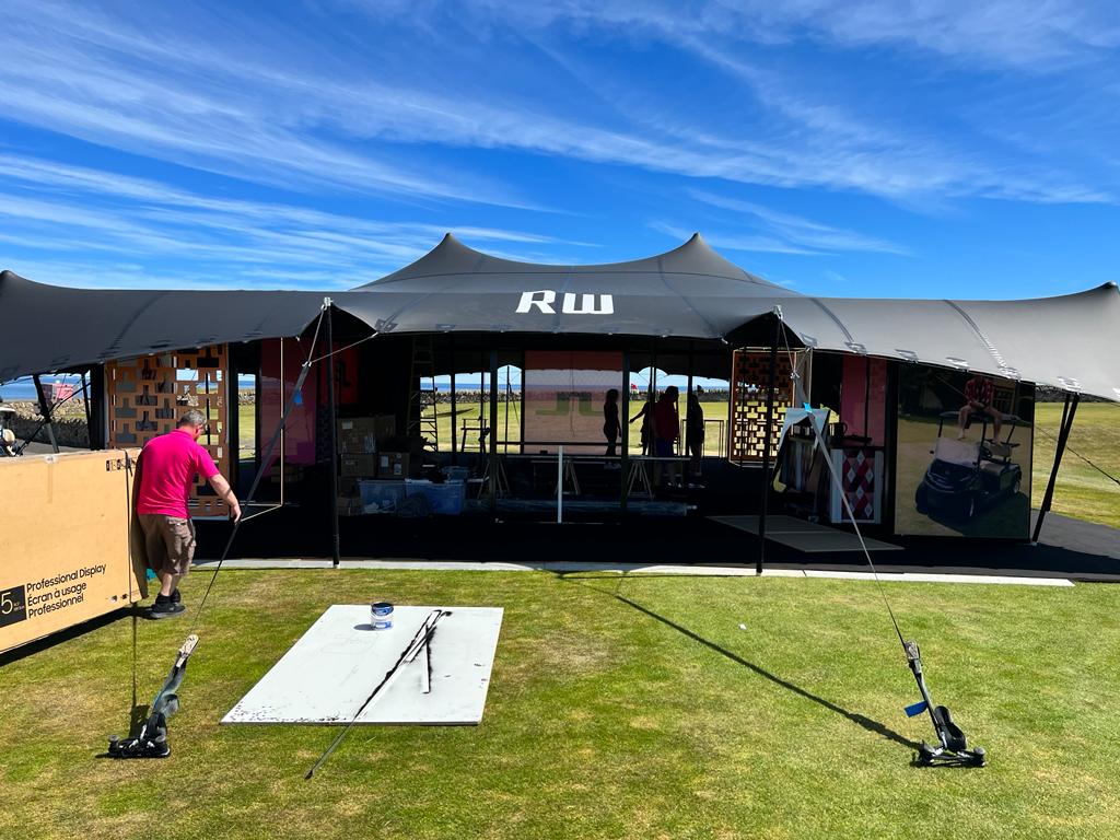 black stretch tent with logo, by Countyside Events